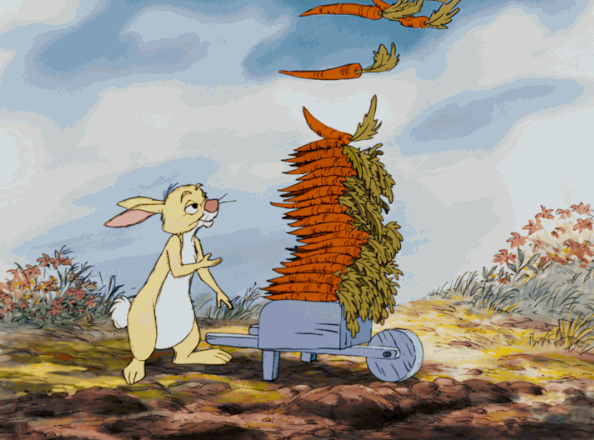 Rabbit wheeling a bunch of carrots